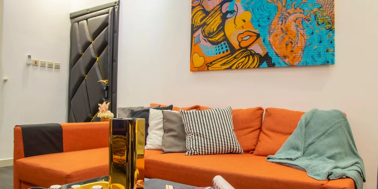 Acoustic panels and a sound blanket mounted on the inside of an apartment door