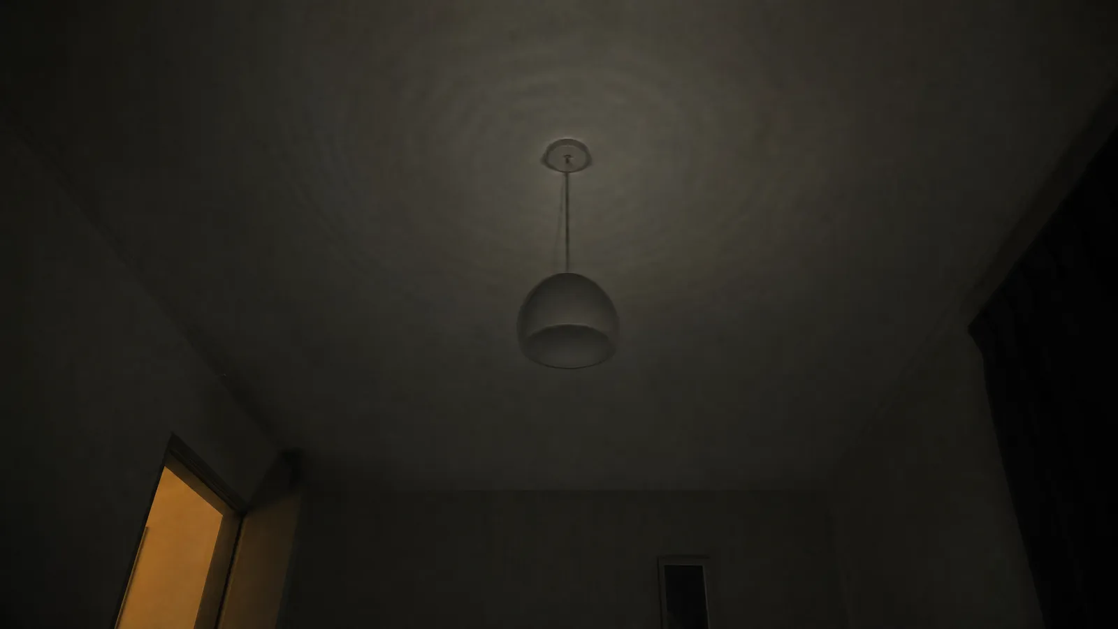 An apartment bedroom ceiling at night with a pendant light blurred by vibration